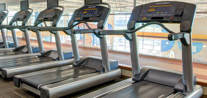 a row of unused treadmills