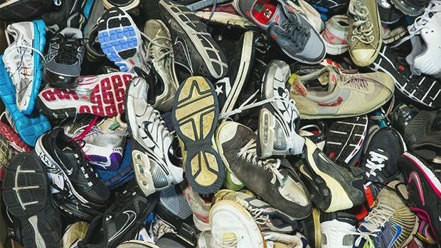 pile of old worn out sneakers