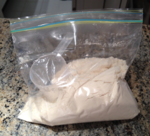 clear bag holding protein powder