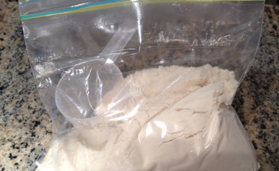 clear bag holding protein powder