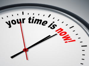 a clock with the words your time is now pushing urgency to grow your business