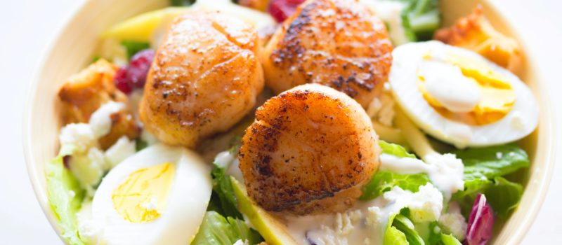 Salad with scallops, egg, lettuce, creamy white dressing