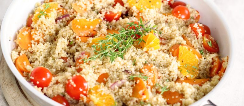 Bowl of couscous with vegetables and fruit